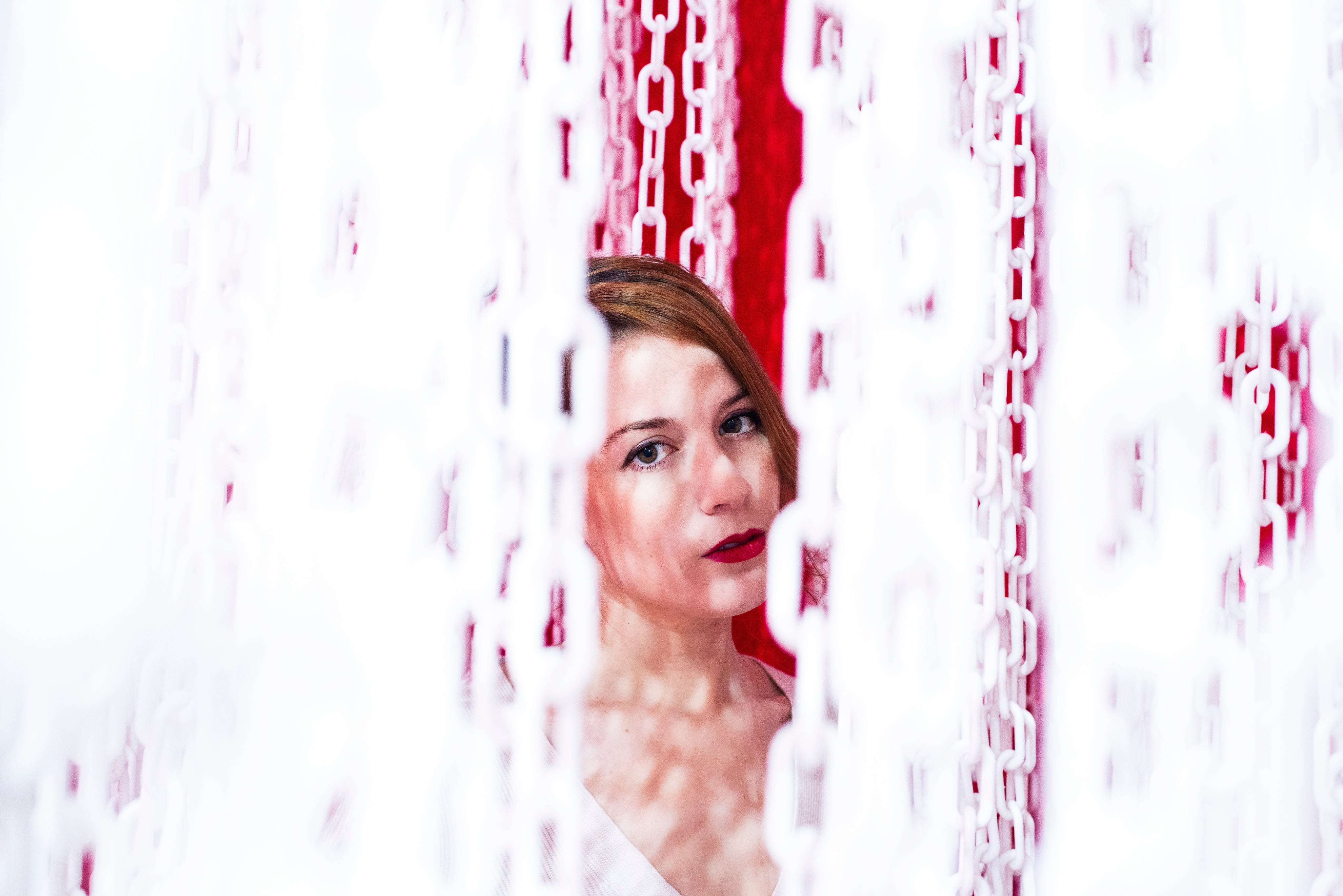 files/woman-peering-out-from-a-curtain-of-chains.jpg